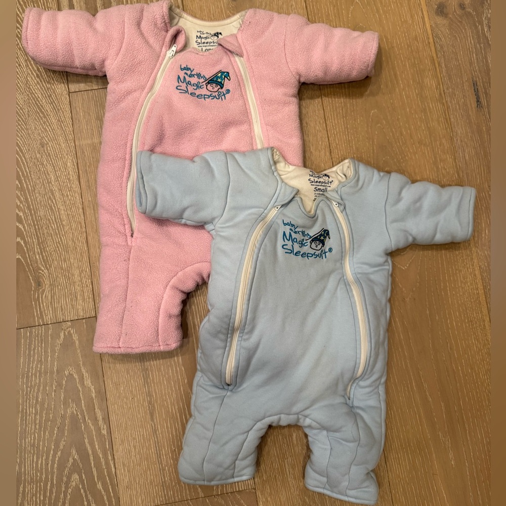 Baby Merlin Magic Sleep Suits in larger Pink and smaller Blue Set of 2